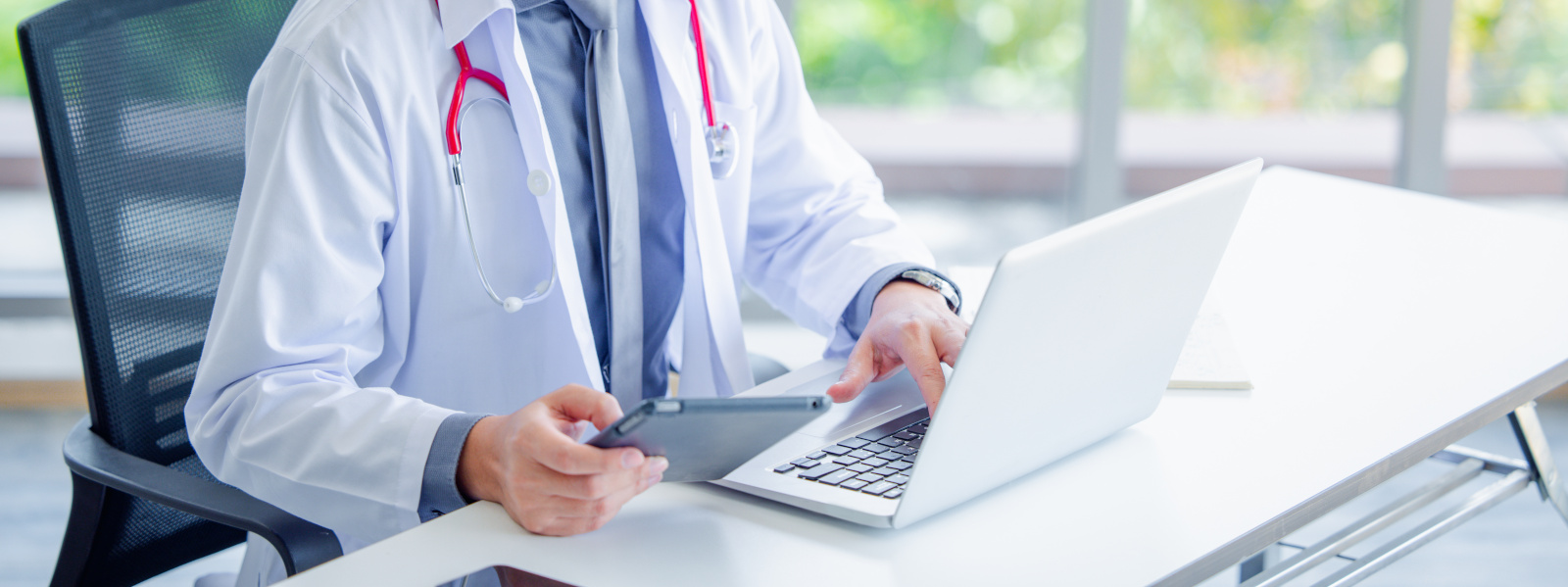 Doctor using online health consulting on computer pc and digital tablet, Tele medical healthcare concept, Banner with copy space