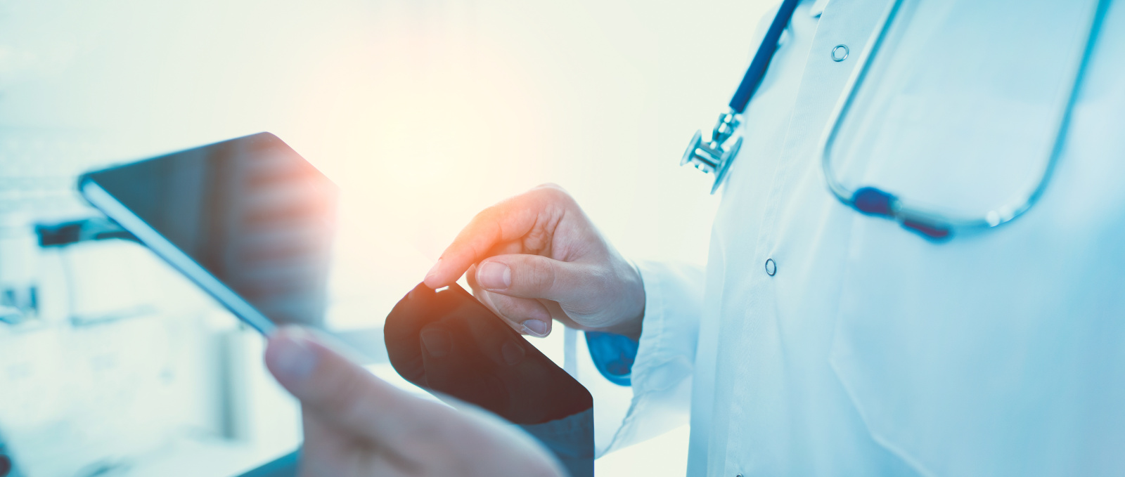 Doctor using tablet in clinic
