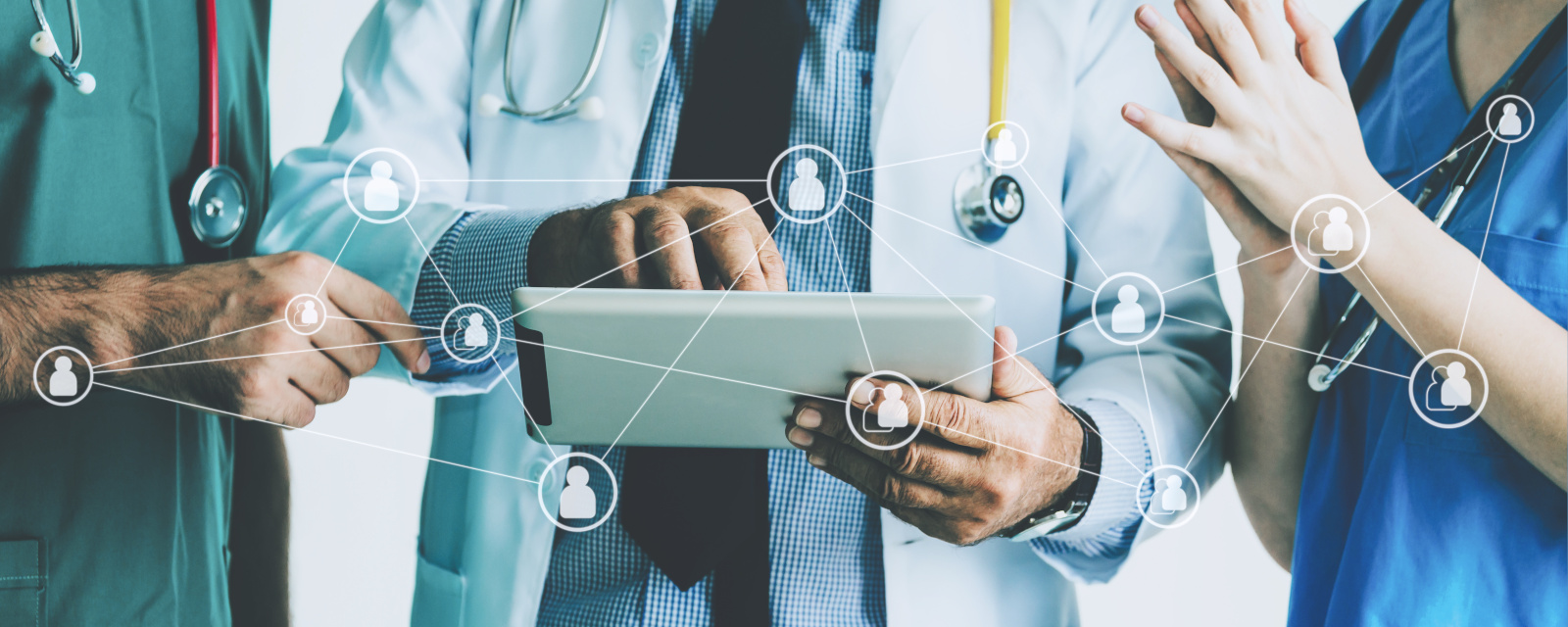 Group of doctor with tablet and graphic network Concept image of group of healthcare staff. Showing people icons and smart device: The WorkTracker app for a mobile workforce