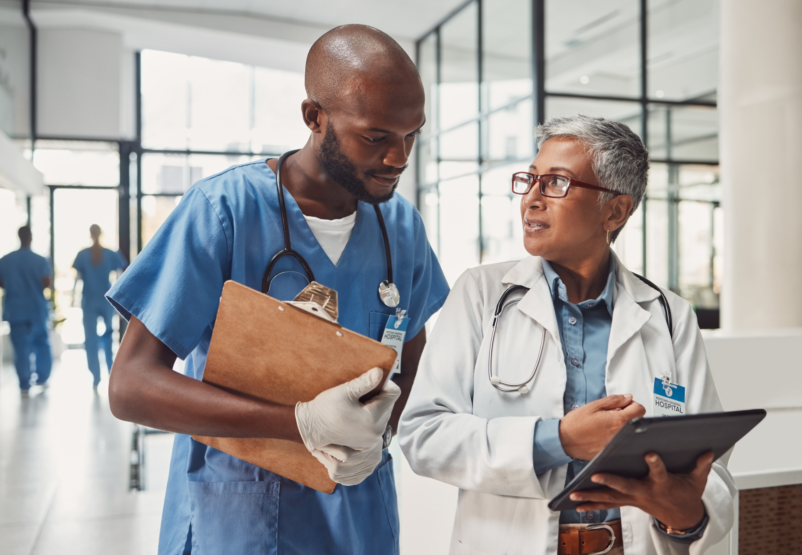 Doctors, nurse and teamwork on tablet for hospital management, data report and black people support. Clinic results, research and data analysis of professional healthcare worker and medical manager