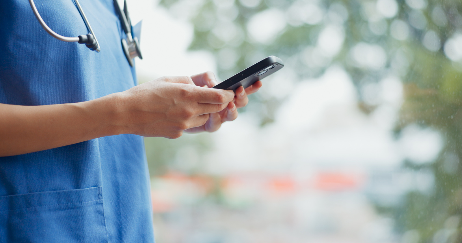 Nurse using mobile timesheet app concept