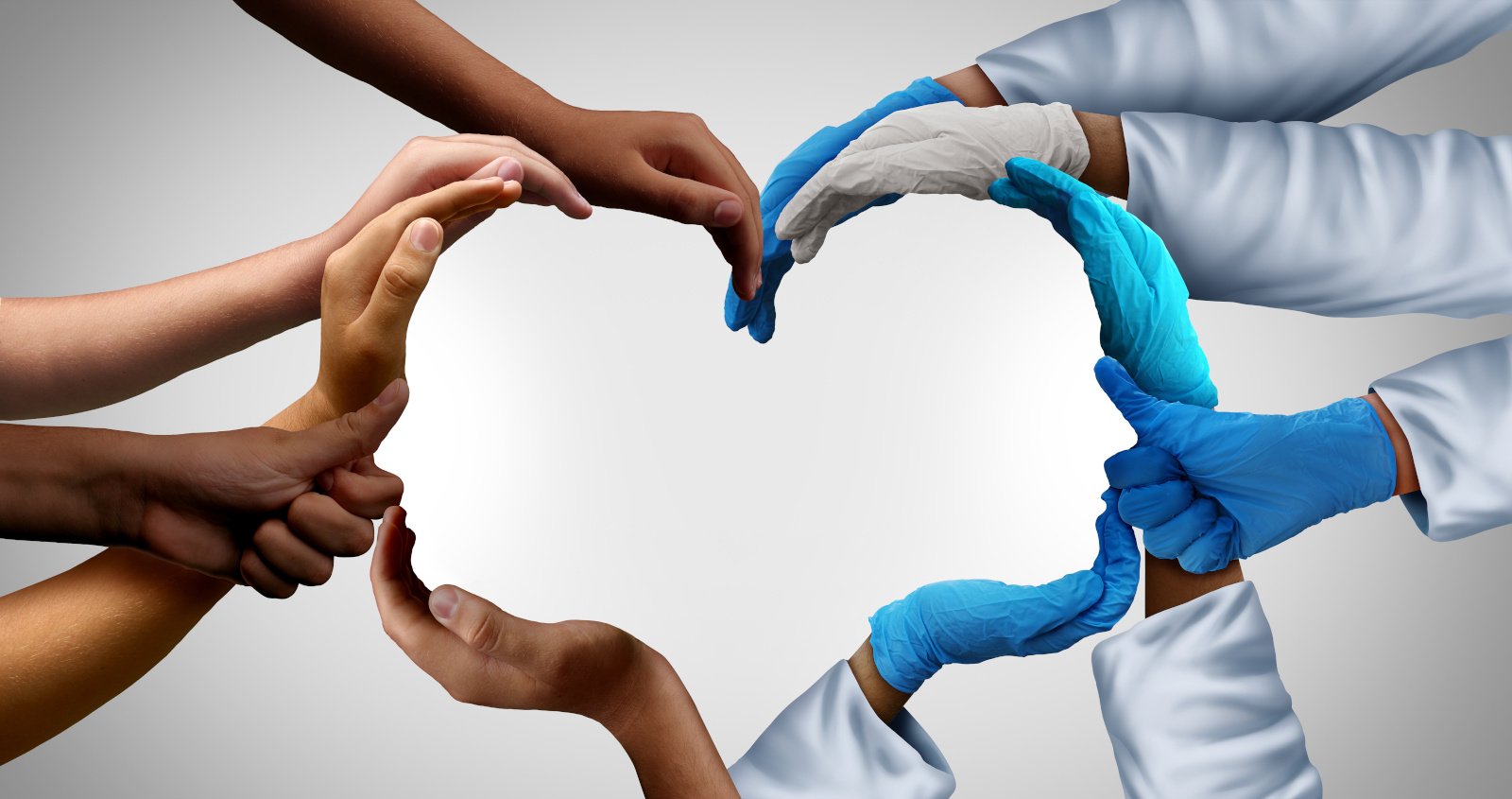Team working concept image: healthcare staff linking hands to form heart