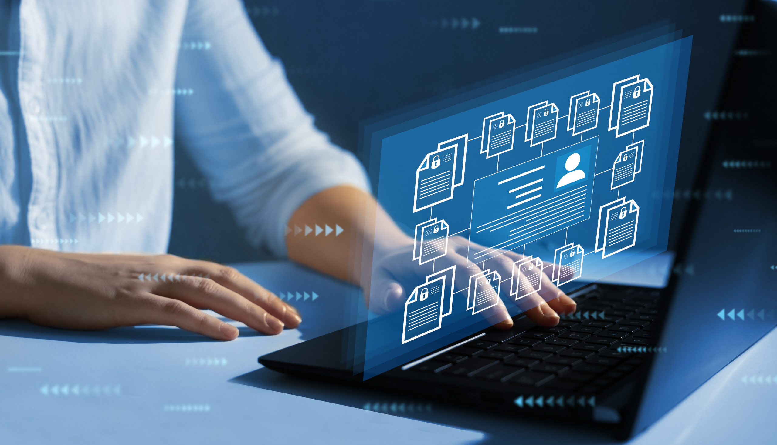 as470307365-YouRecruit-Recruitment-agency-consultant-at-laptop-with-employee-compliance2 Agency administrator at desk with laptop showing certification compliance issues for employee notification: WorkTracker