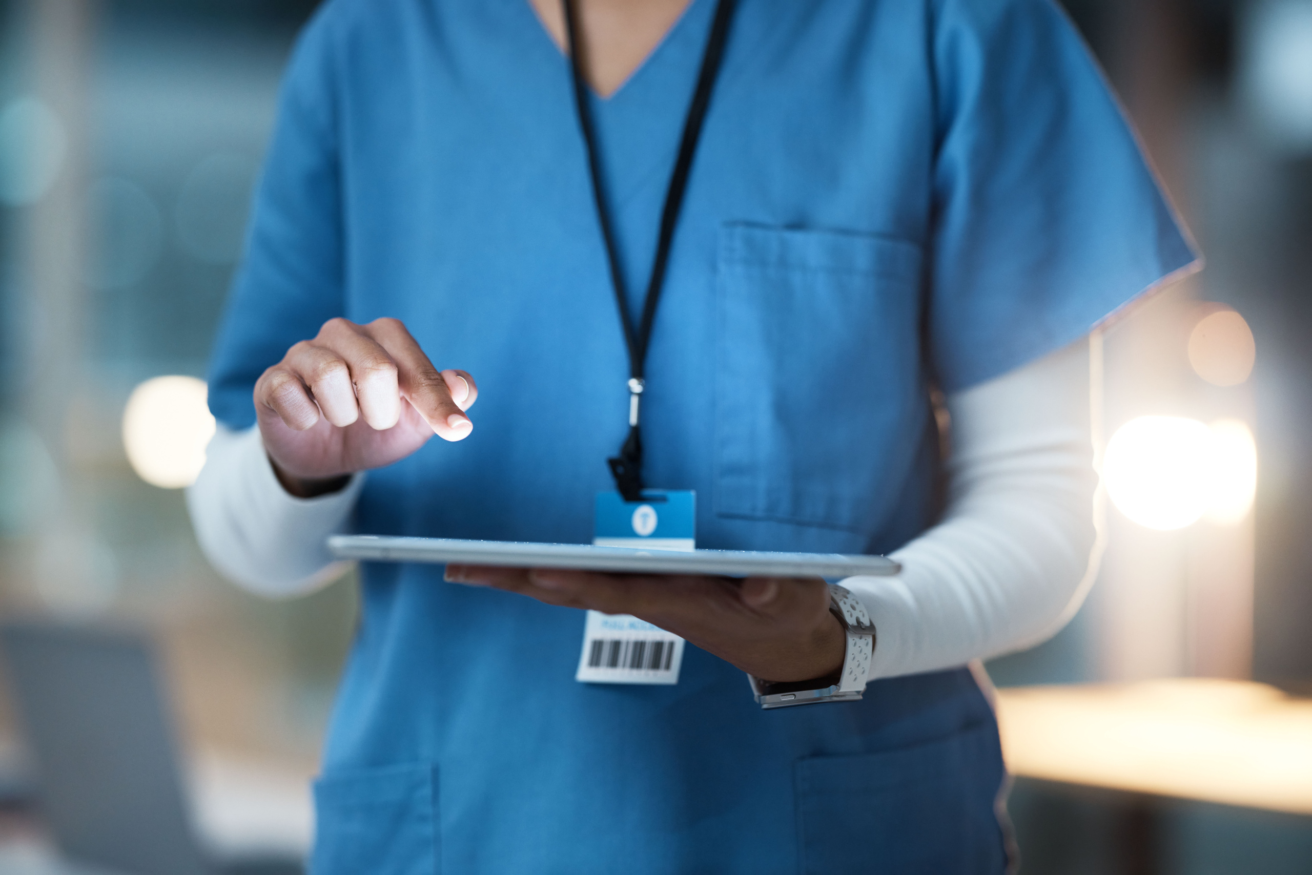 Cropped image of temporary healthcare worker using the WorkTracker employee time tracking app: YouRecruit healthcare software