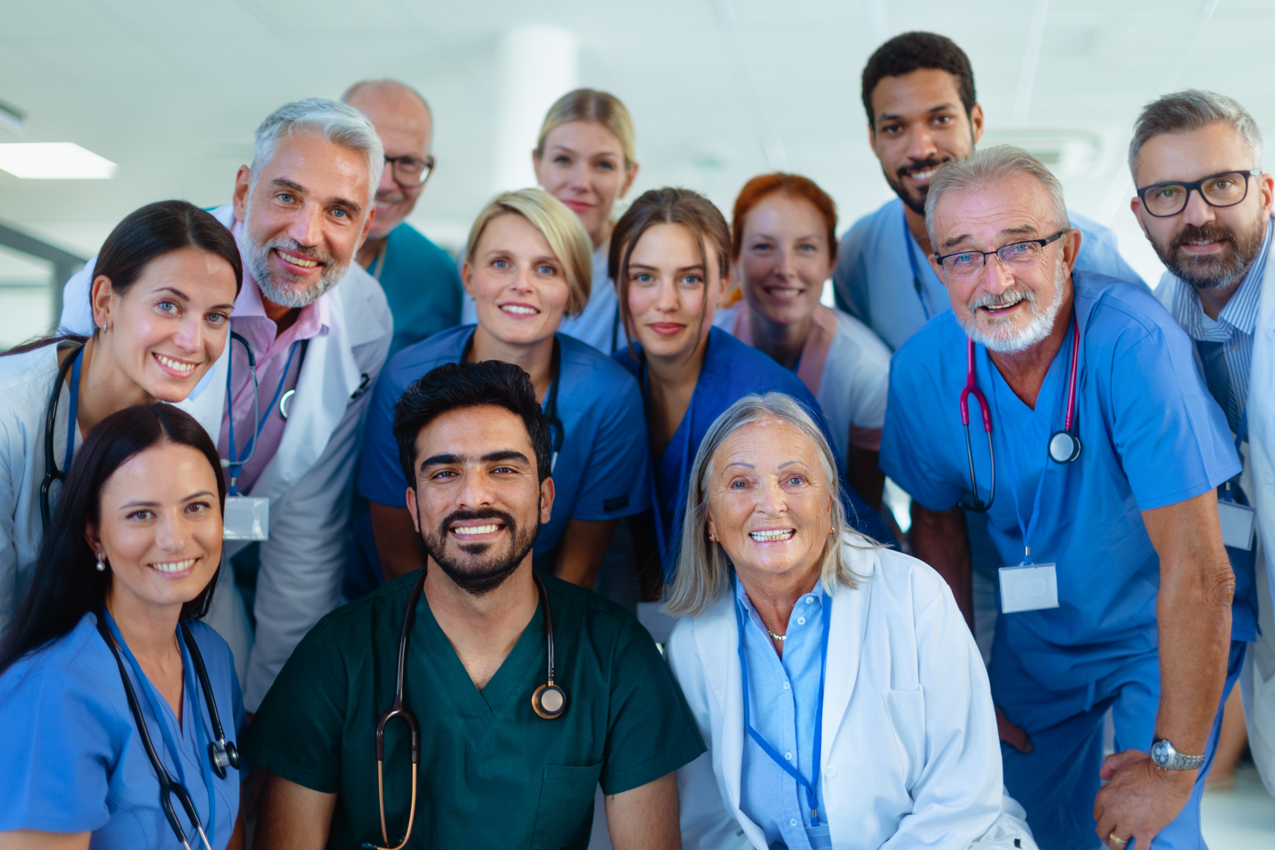 env-yr-portrait-of-happy-doctors-nurses-and-other-medica-2024-10-22-06-16-44-utc2 Image of happy group of newly onboarded temporary healthcare staff: Onboarding employees with YouRecruit HR software