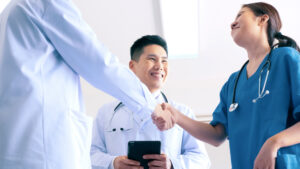 New temporary healthcare female employee being welcomed at new work location: The YouRecruit staff communication platform