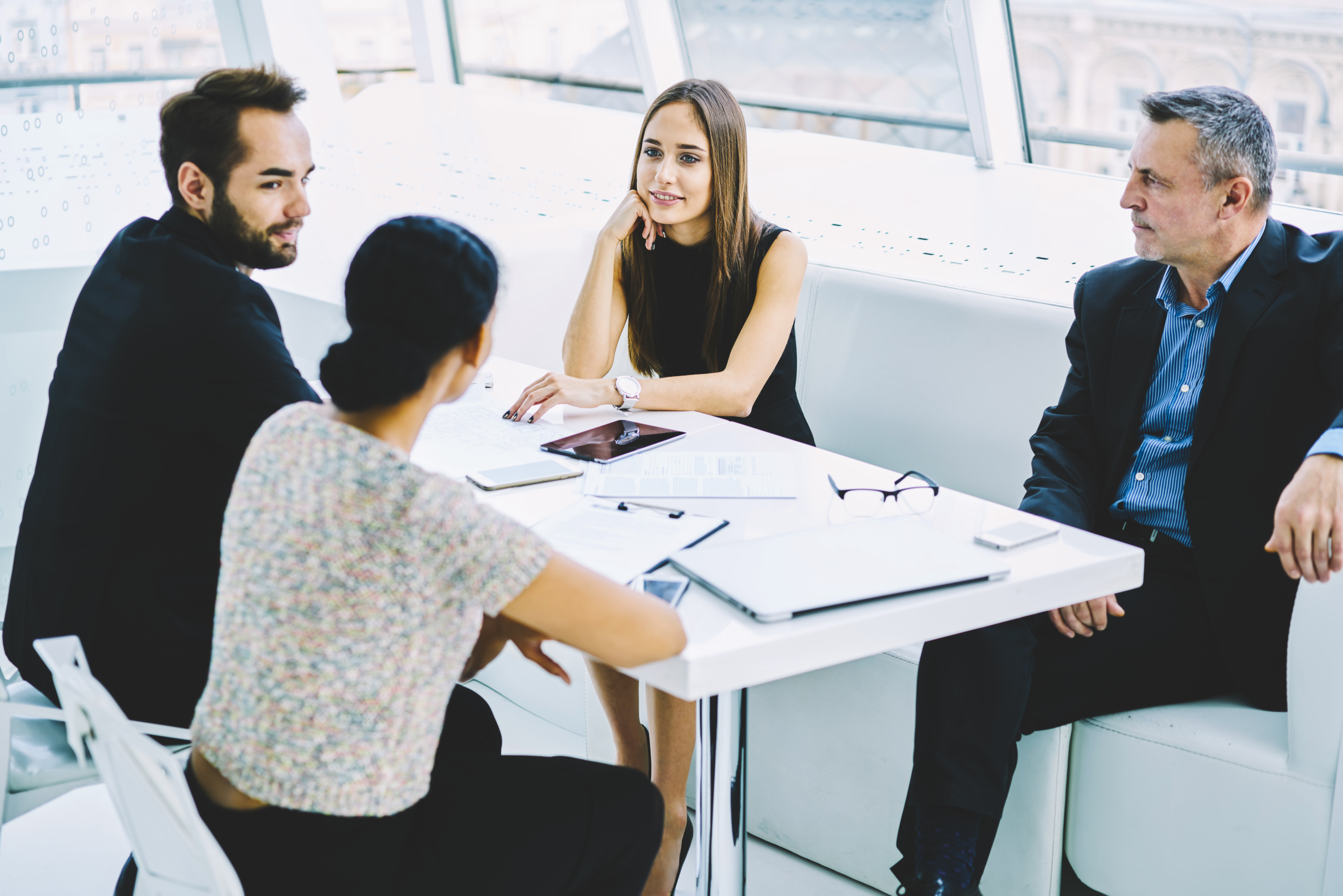 Recruitment agency consultants with two new employees during the hiring process: Onboarding employees with YouRecruit