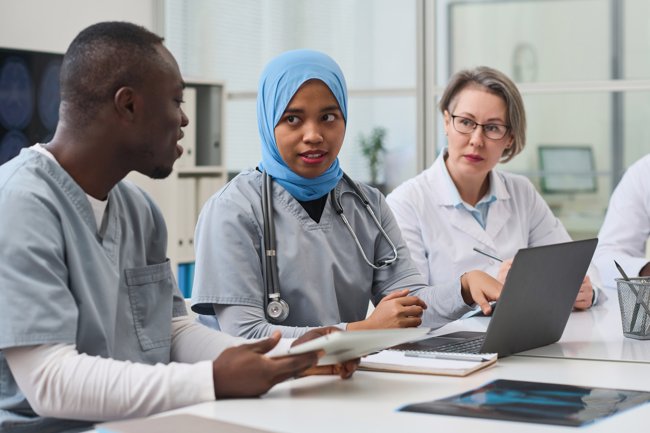 Group of medical professionals receiving mandatory training to stay role compliant: Compliance administration with YouRecruit