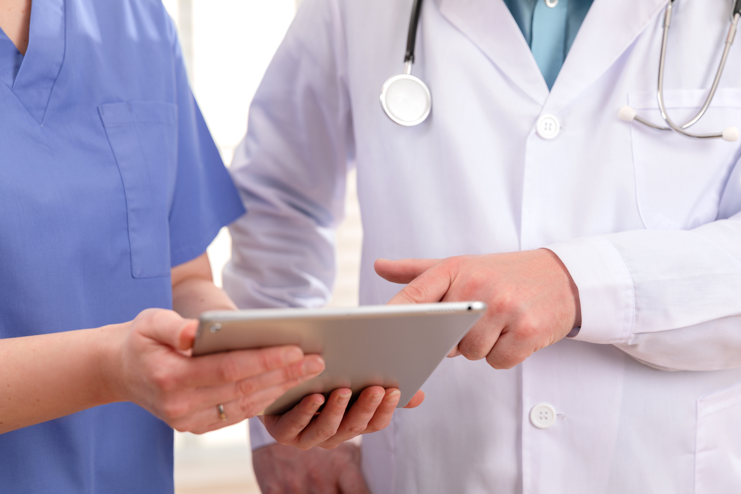 Nurse having her timesheet signed off at the end of a shift: The WorkTracker mobile timesheet app and rota shift planner