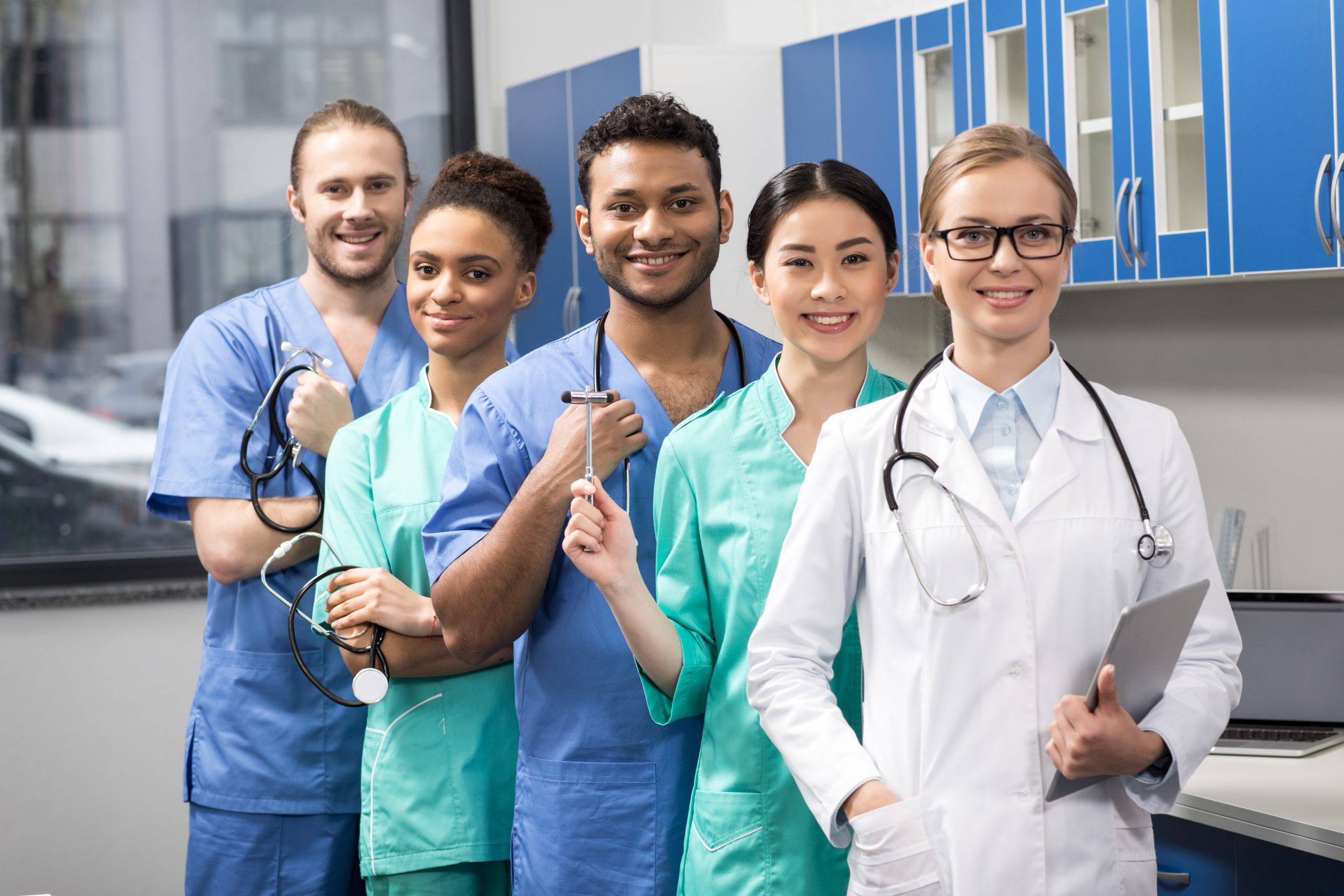 Happy group of temporary healthcare employees in different roles: The WorkTracker clock in clock out and mobile timesheet app