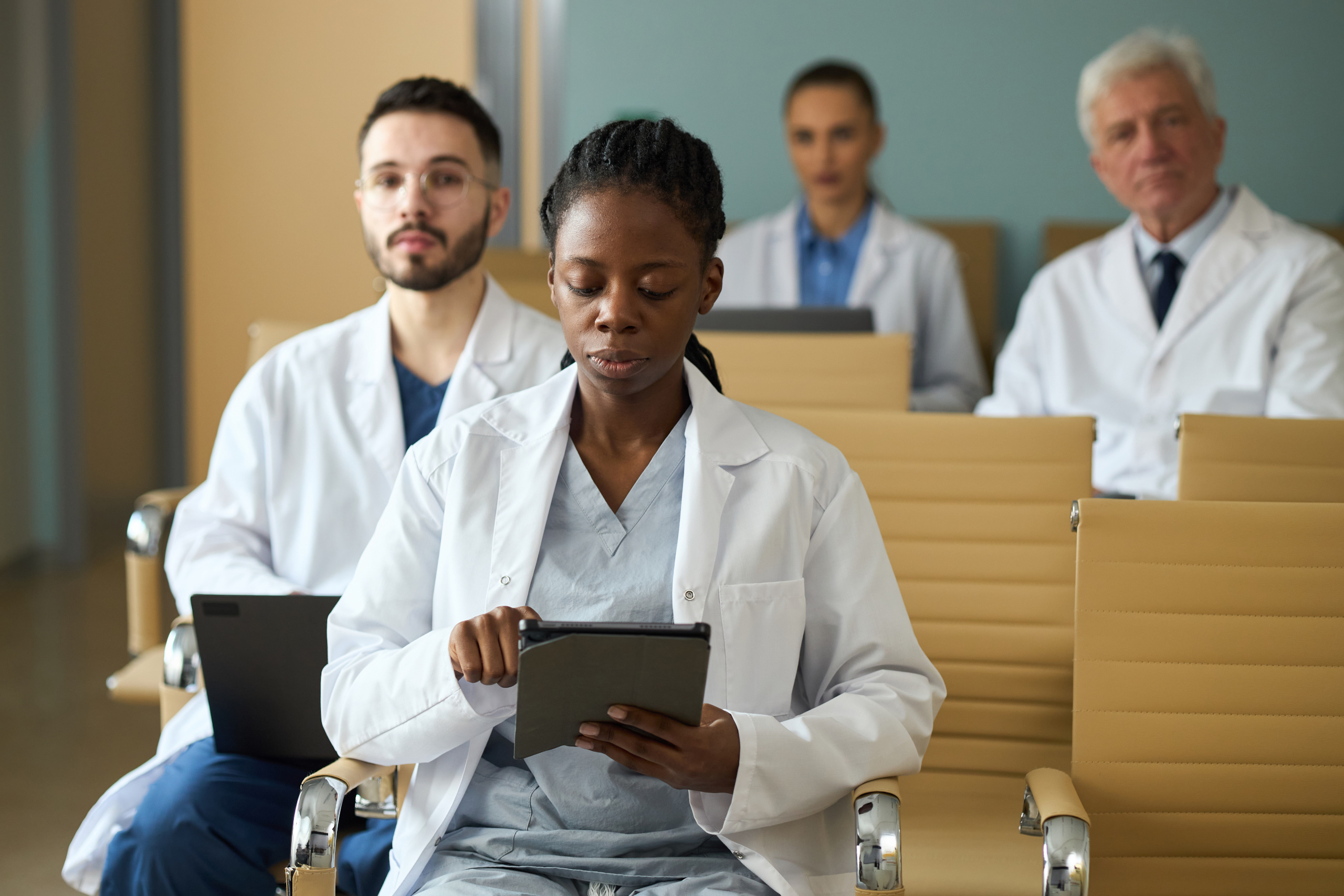 Healthcare staff at hospital on the first day of placement after the employee onboarding process: The YouRecruit HR software 