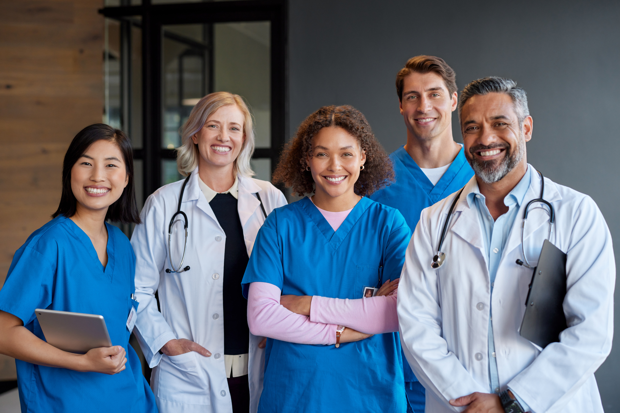 Happy temporary healthcare employees in various roles: The WorkTracker timesheet app helps payroll arrive on time